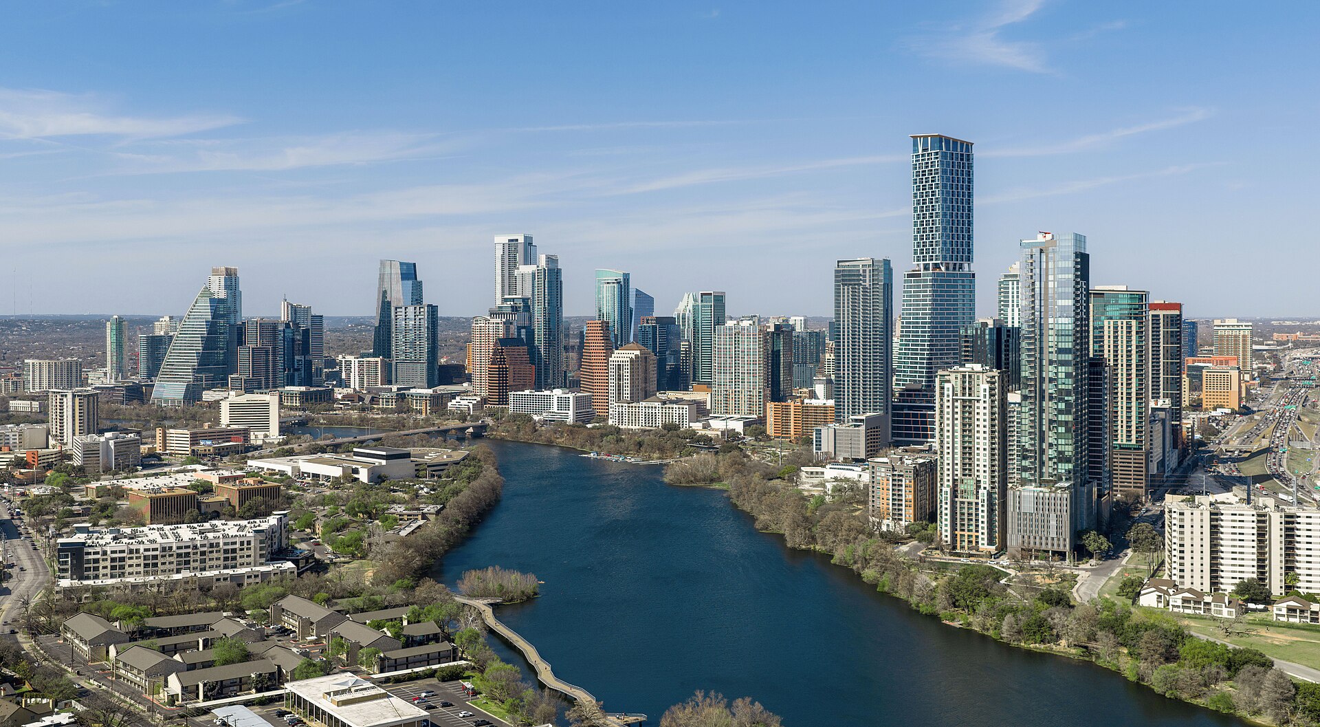 Downtown Austin's high-rises along Lady Bird Lake on a clear day.