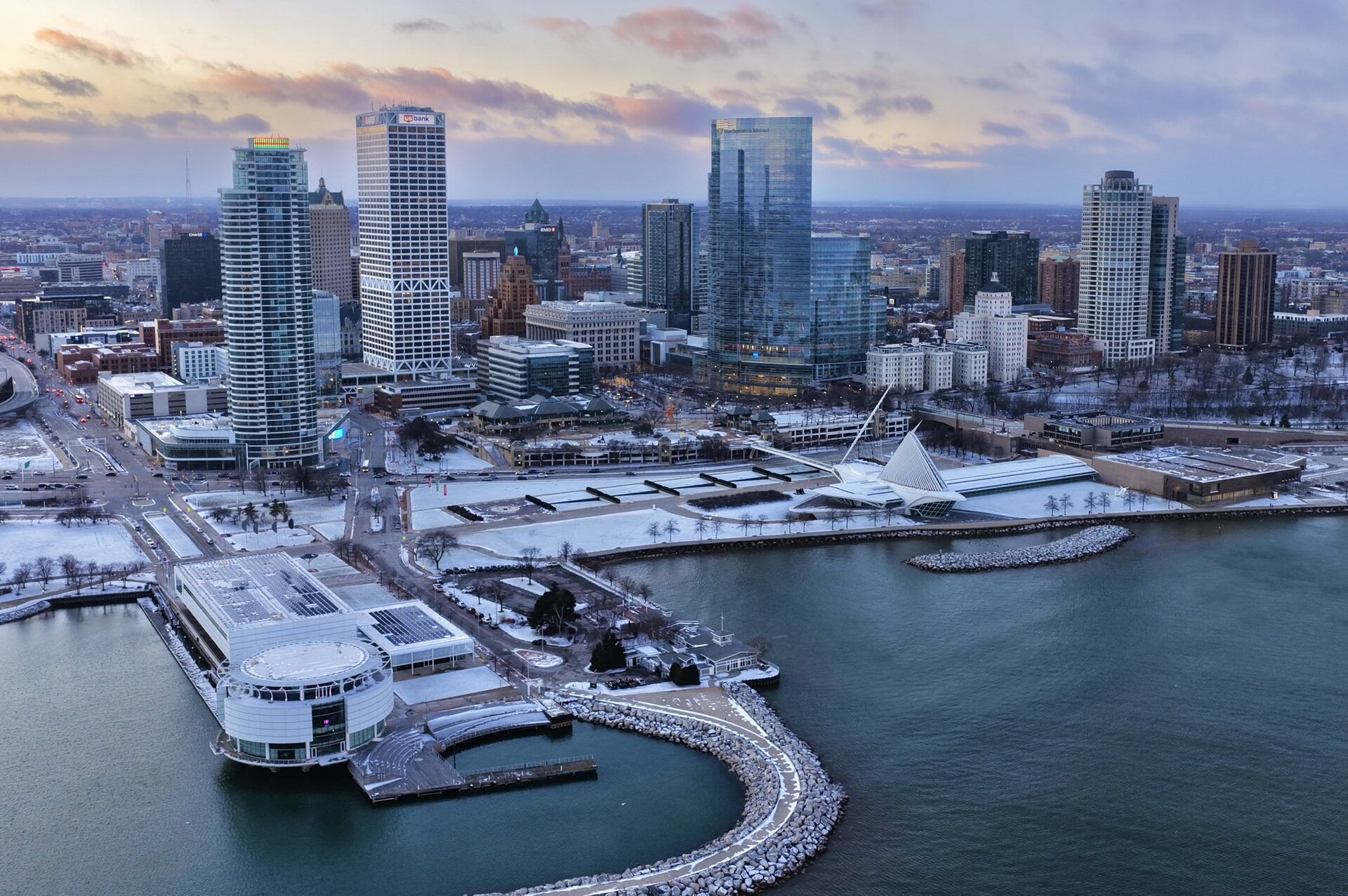Milwaukee's downtown towers above the snowy lakefront, with the winged Milwaukee Art Museum on Lake Michigan.