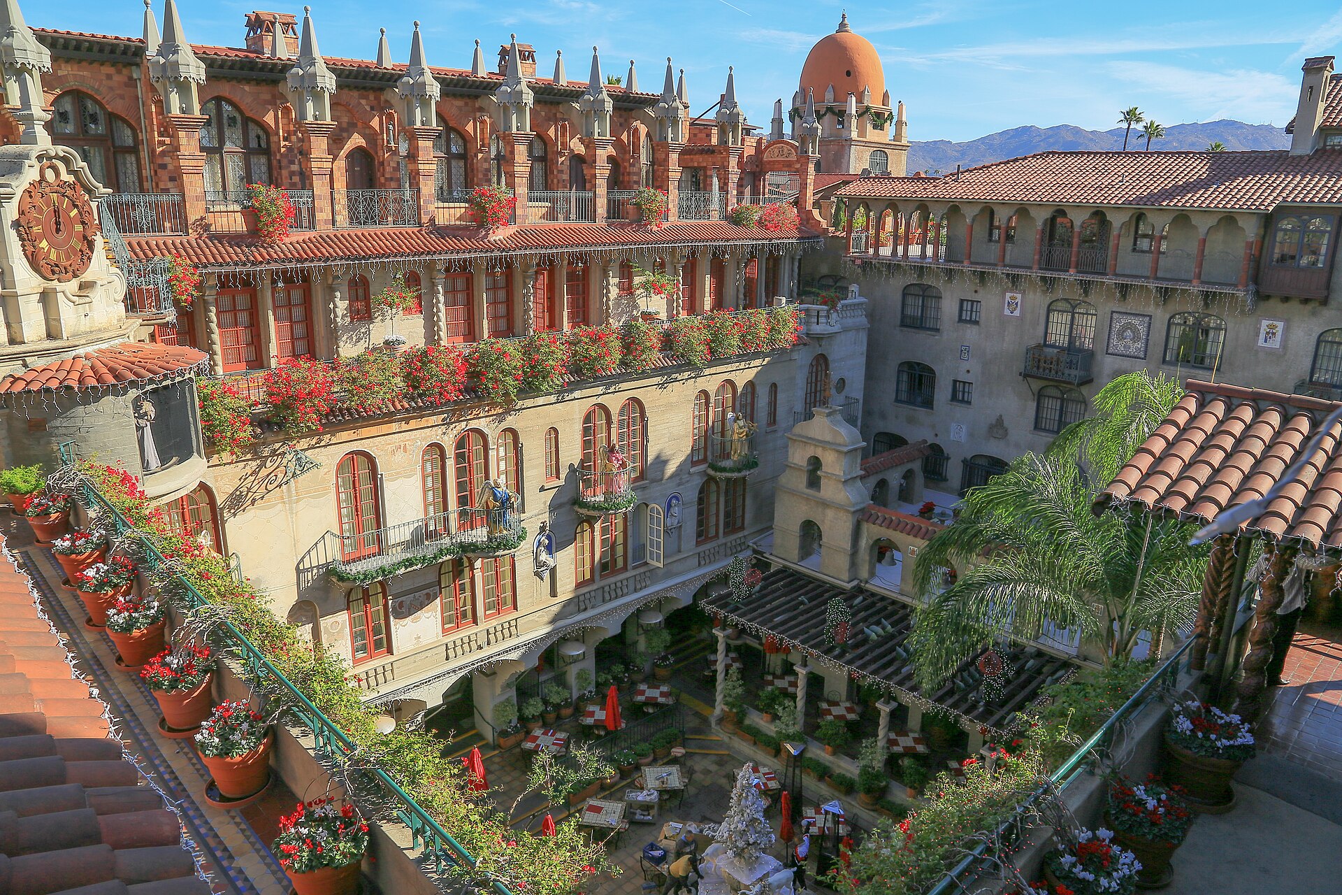 Arched balconies, flower boxes and a copper dome around the courtyard of the historic Mission Inn in Riverside.